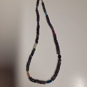 A troll beads necklace and flower clasp